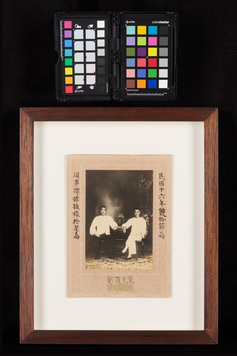 Studio portrait of two Chinese men