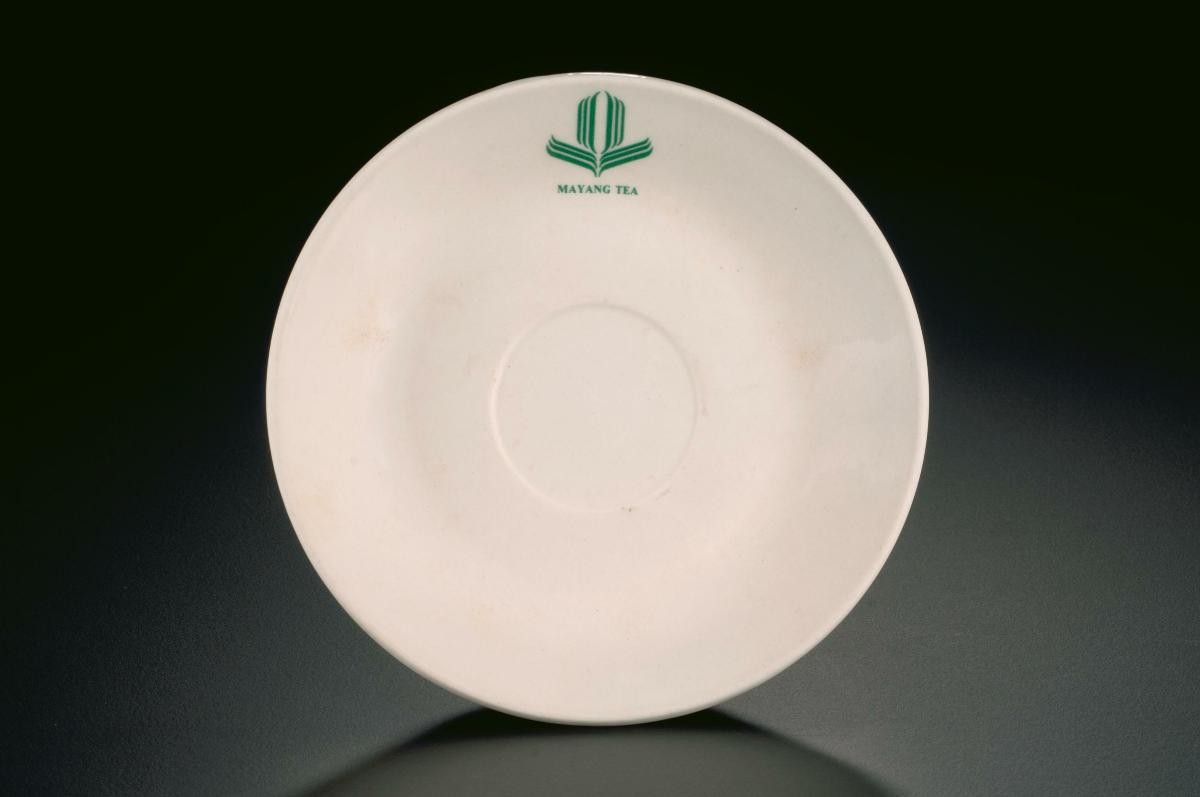 White porcelain saucer with ‘Mayang Tea’ logo