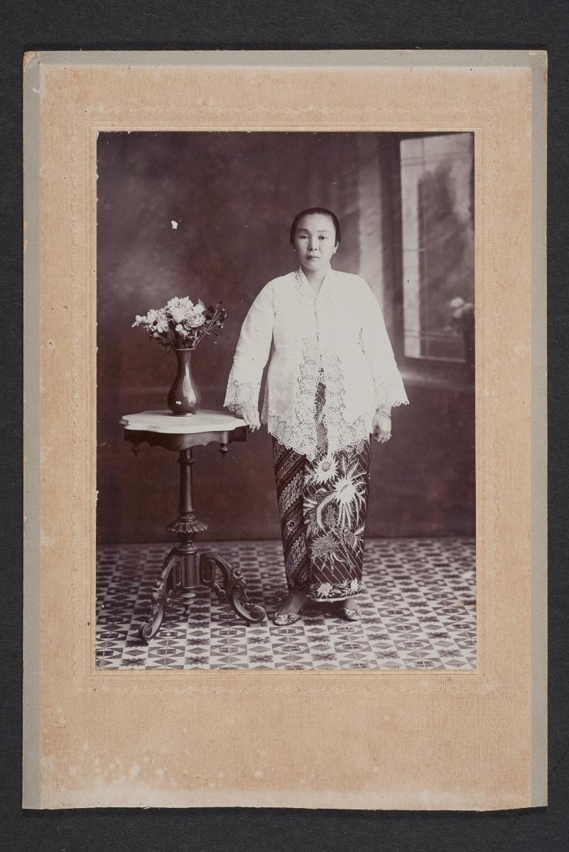 Lauw Fong portrait of a nyonya beside a vase of flowers