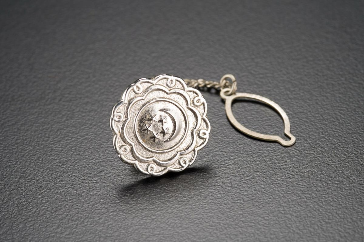 Collar badge belonging to Mr Swaminathan Stephens Rahjan