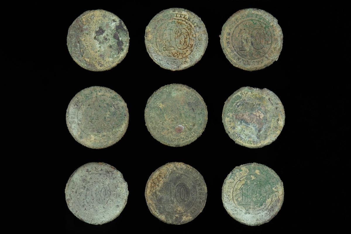 Nine 10-cent coins exhumed from Bukit Brown Cemetery, peg no. 2976