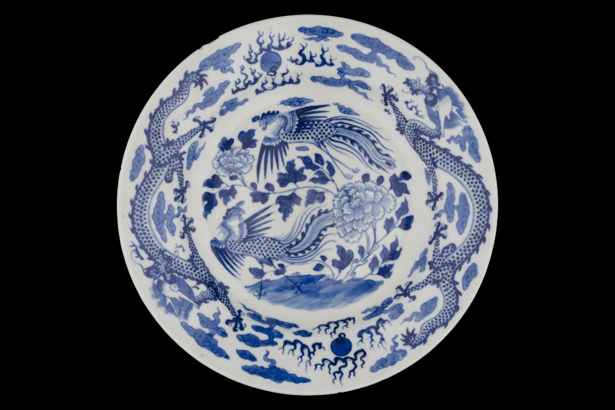 Blue and white plate with dragon and phoenix motif