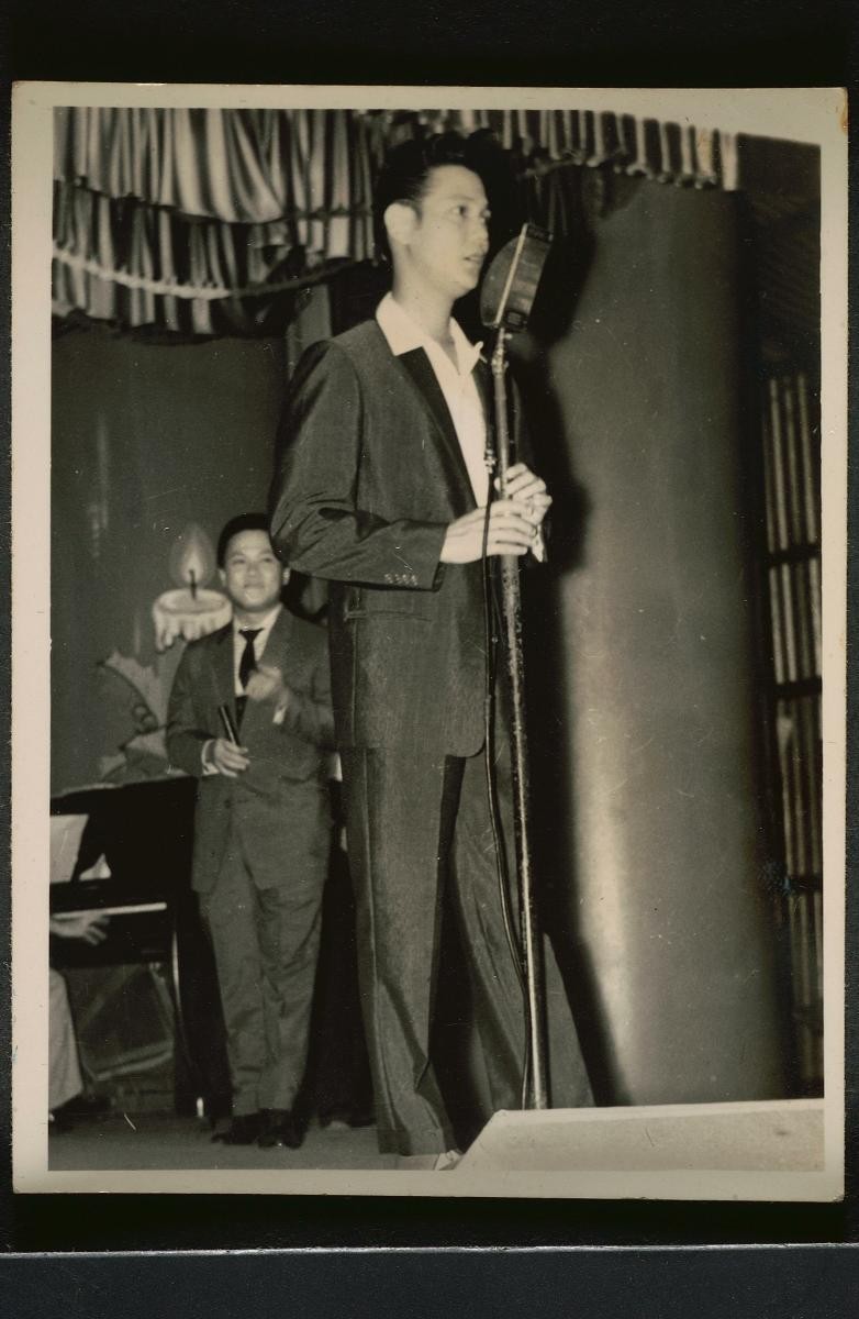 A Chinese man performing on stage