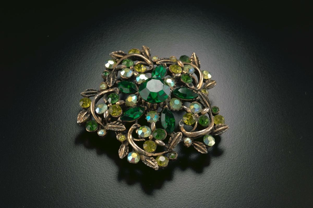Green diamanté brooch that belonged to a notable women's rights activist