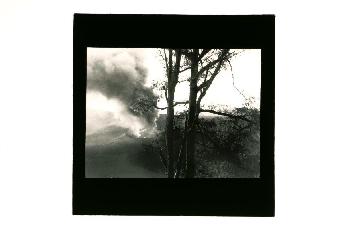A glass lantern slide depicting a volcanic eruption